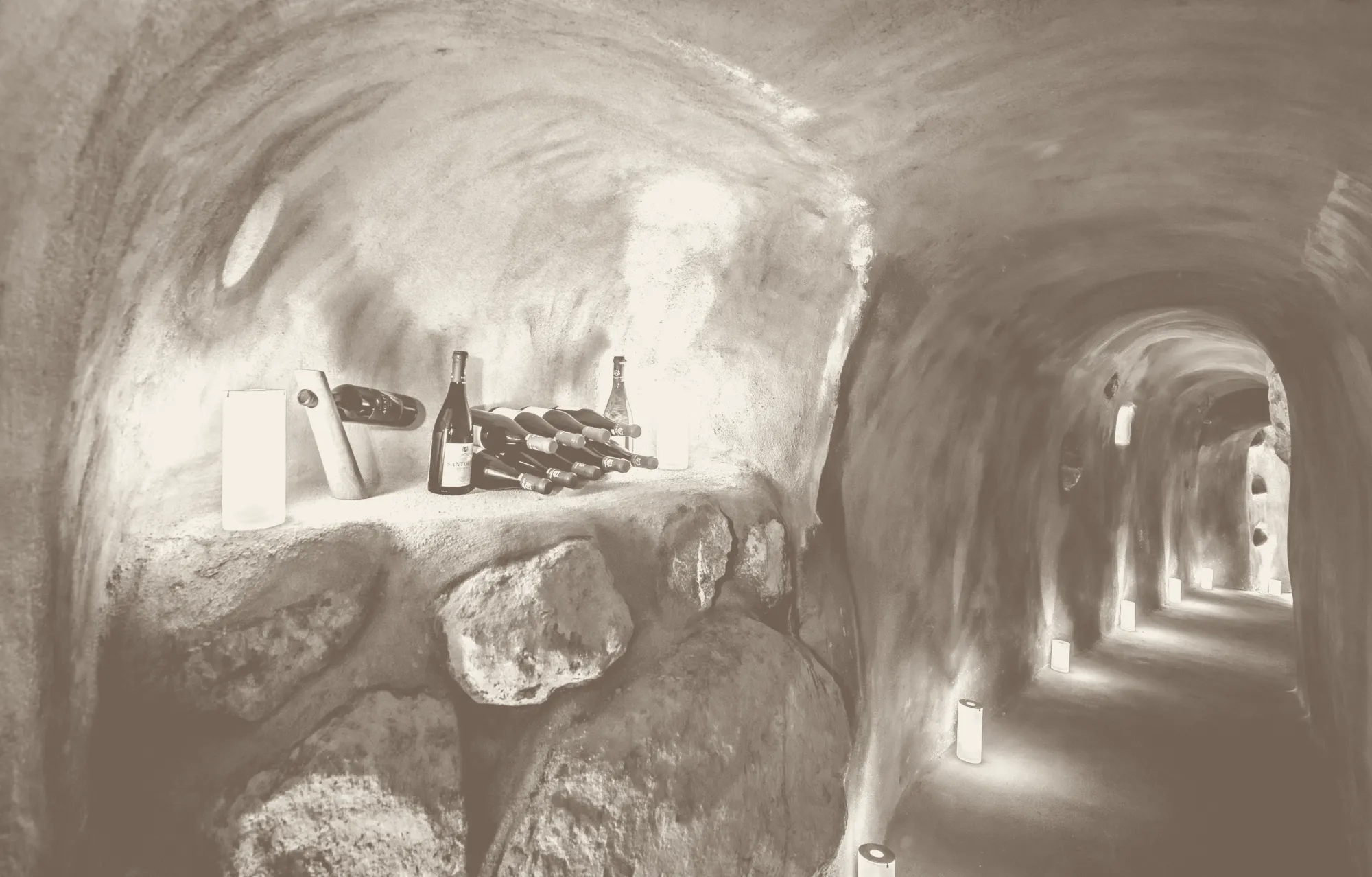 Bottles resting on a ledge of stone in the canava